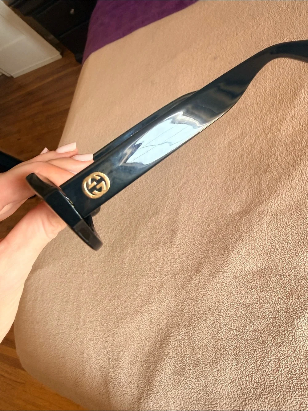 Gucci Black Oval Sunglasses with Gold Logo Accent